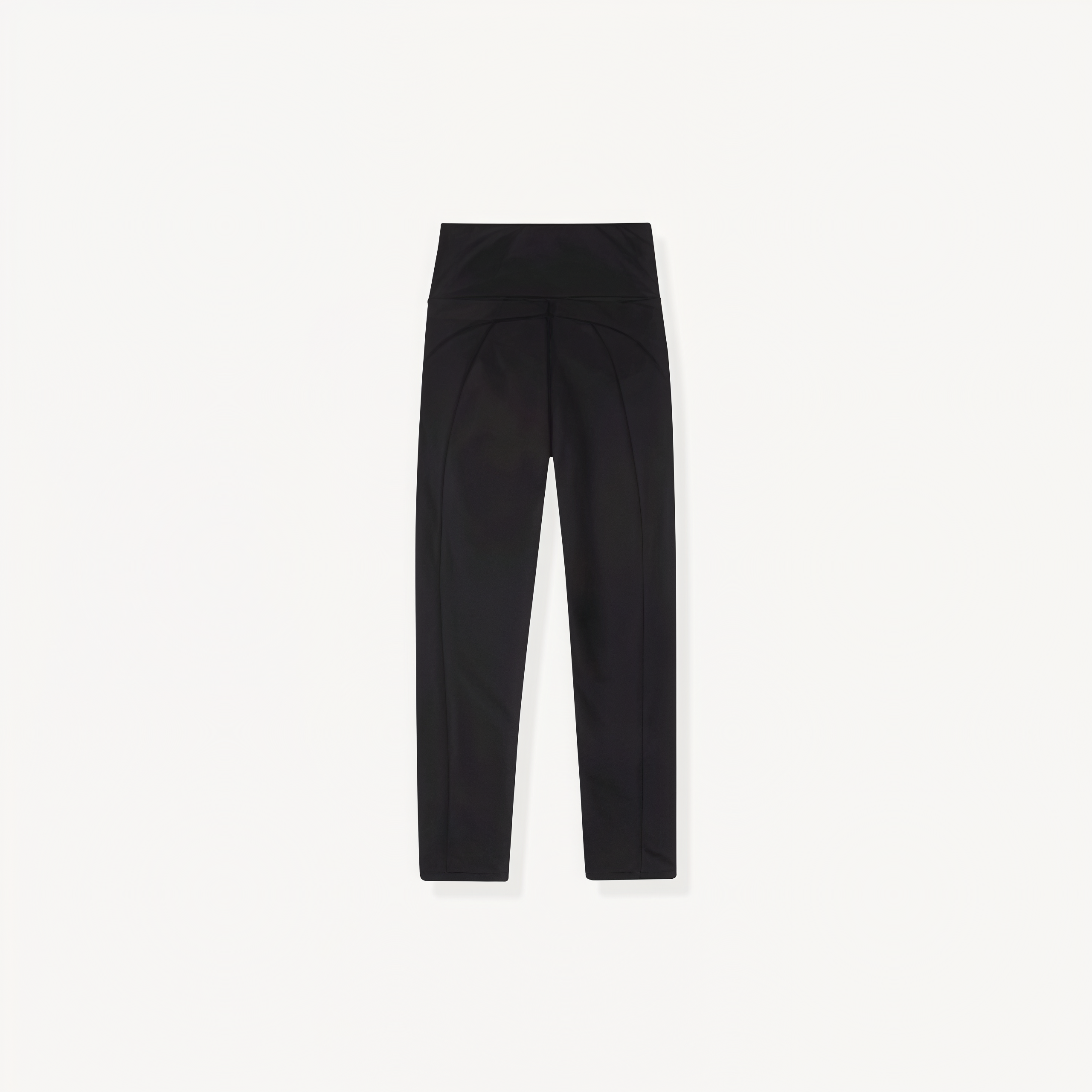 Black athletic leggings with ENVOLE logo on a white background back view.