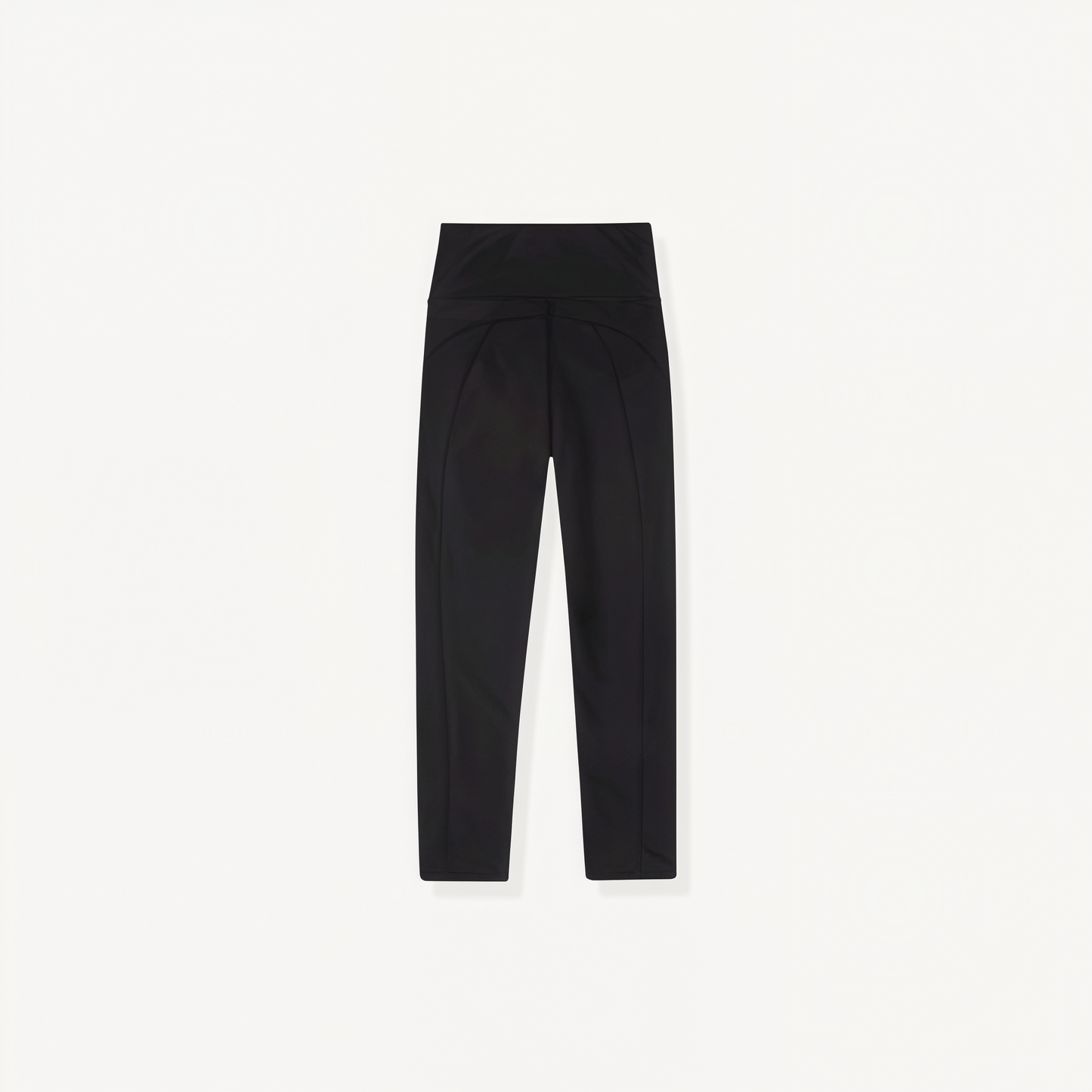 Black athletic leggings with ENVOLE logo on a white background back view.