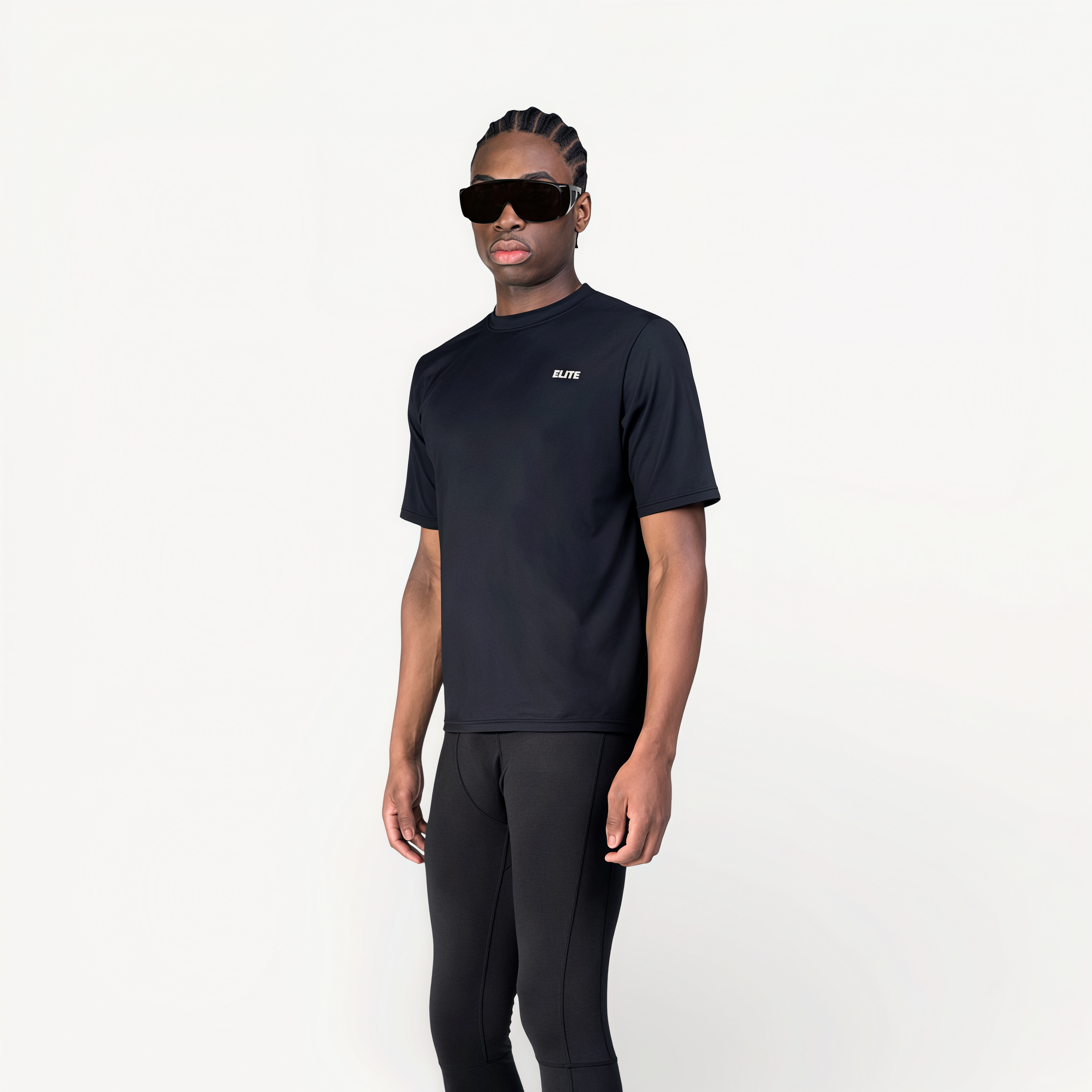 Man wearing a black athletic T-shirt with ‘Elite’ ENVOLE branding.