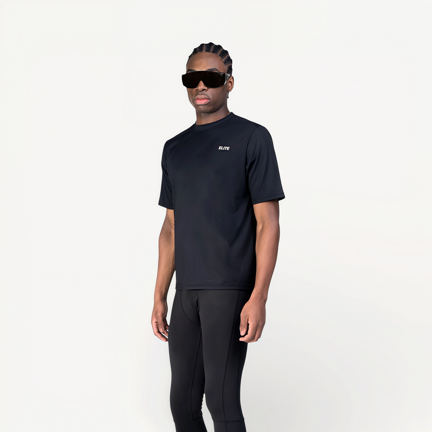 Man wearing a black athletic T-shirt with ‘Elite’ ENVOLE branding.