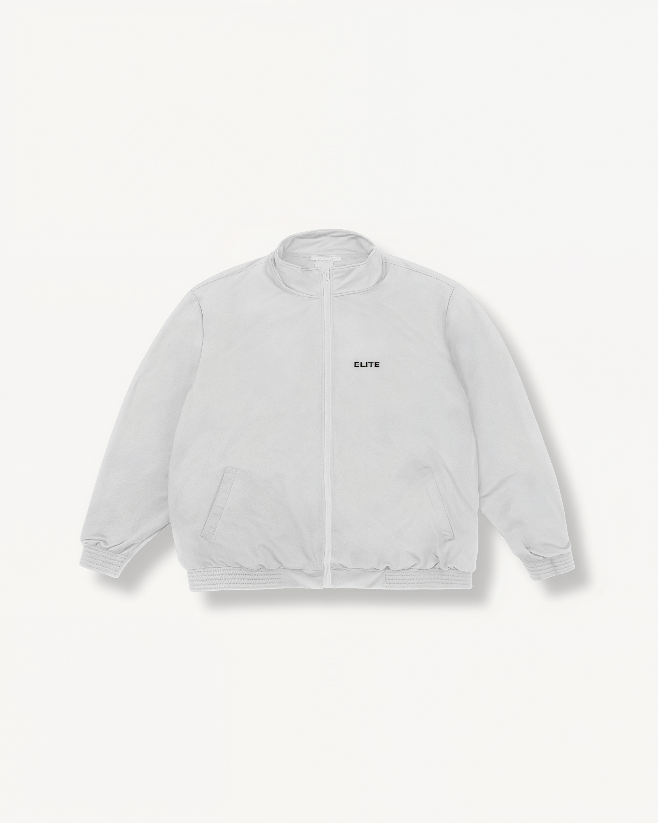 White jacket with ‘Elite’ ENVOLE logo on a light gray background front view.