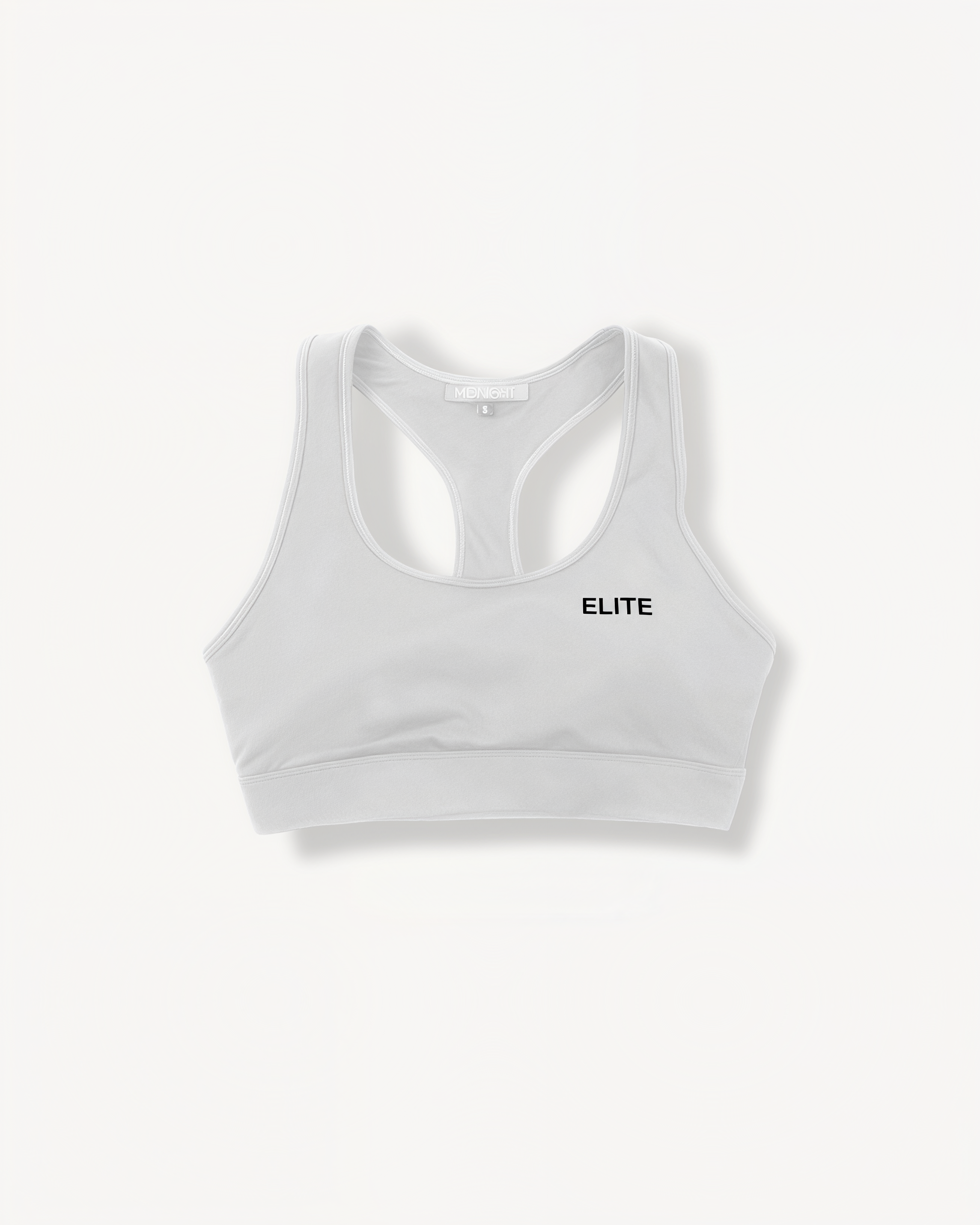 White sports bra with 'ELITE' ENVOLE logo on a white background front view.